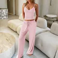Soft pink two-piece yoga loungewear set featuring a camisole top and matching wide-leg pants - XS / Pink