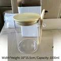 A 1000ml glass storage jar featuring a natural bamboo lid and matching wooden spoon. - 10cm x 15cm (With Wood Lid + Wood Spoon)
