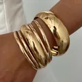 Elegant set of various width polished gold-tone alloy bangles for a retro ethnic look - 34 KC Gold 9991 (6-Piece Set)