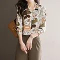 Elegant womens long sleeve button-up shirt with artistic abstract face print in earthy tones - XS / White
