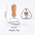 Triangular zinc alloy cookie cutter mold with ergonomic wooden handle for pastry work - Pine Cone Shape