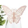 Détail d'une décoration papillon découpée au laser en or rose pour carte de table - Perle de Jade