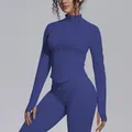 Detailed view of women's slim fit navy blue zip-up yoga jacket with a stand collar - Navy Blue