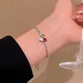 Vintage silver-tone bracelet featuring green white and red stones on a female wrist - S832 Silver - Dopamine Zirconia Heart Bracelet