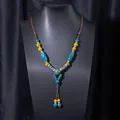 Ethnic style ceramic bead necklace with blue and yellow beads on brown woven rope - X470 Blue Small Ball