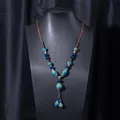 Ethnic style long sweater necklace featuring blue ceramic beads and hand-woven brown rope - X470-6 Round Blue