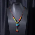 Handmade ethnic ceramic necklace featuring colorful beads and a blue heart pendant - X470-10 Heart Multicolor