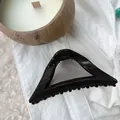 Glossy black hollow triangle hair claw clip for elegant hair styling - Bright Black