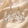 Elegant silver pin earrings with delicate white iridescent flower petals in Korean style - Translucent Pearlescent Petal Tassel Style (E1307)