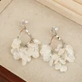 Elegant white petal tassel earrings with silver finish and sparkling cubic zirconia - Silver Spiral Plate Clip-on Petal Style (E1143-9/Silver)