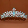 Macro detail view of a baroque style silver tiara with intricate light blue stones - No.1 Silver (Opal Green Stone)