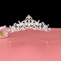 Close-up of an elegant silver Baroque crown featuring intricate crystal details. - No.1 Silver Small (White Stone)