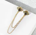 Elegant bee-shaped gold-toned lapel pin with double tassel chains and sparkling crystals - Gold & Black Bee (X10303)