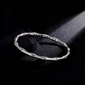 Elegant silver stainless steel bamboo joint bracelet with polished finish. - Steel Bamboo Round