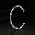 Elegant silver stainless steel bamboo cuff bracelet with a minimalist open design. - Steel Color C-shaped Bangle (14-B-11)