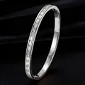 Elegant silver-tone stainless steel bangle featuring channel-set baguette-cut crystal inlay - Steel Color Baguette Cut Style (44-E-1)