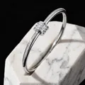 Elegant silver stainless steel bangle featuring a pavé-set zircon center charm. - Silver Waist Style Sliding Bead Bangle