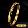Elegant 6mm wide polished gold titanium steel bangle for women in a luxury SKU view - 6mm Domed-Gold