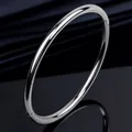 Elegant polished silver titanium steel oval bangle bracelet for women with hinge clasp - Silver Round Line