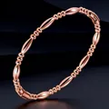 Elegant minimalist rose gold titanium steel bangle with alternating oval bead design - Rose Gold Bracelet (15-E-3)