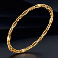 Elegant gold titanium steel bracelet featuring alternating olive and round bead links. - Gold Bracelet (15-E-4)