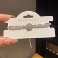 Elegante pulsera ajustable plateada con circonitas cuadradas rosas y claras y centro halo - Plata-Rosa-Color AB