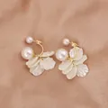 Elegant white petal earrings with pearls and gold-tone finish on satin background - Mother-of-pearl Pearlescent Double Layer Petal Style (E8233)