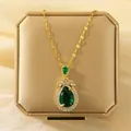 Elegant variant necklace featuring a pear-shaped green gemstone on a gold-toned chain - 202*XL1470-41