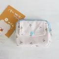 Detailed close-up of a pink corduroy pouch with bow print and blue snap button flap - Light Pink Grey Bow