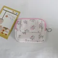 Detail of corduroy floral coin purse with pink snap flap and zipper ring on white fabric. - Purple Pink Small Floral