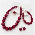 Elegant burgundy pearl jewelry set including necklace, bracelet, ring and stud earrings - Fuschia