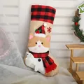 Cute burlap Christmas stocking featuring a plush cat holding a fish decoration. - Christmas Cat Burlap Stocking