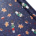 Dark blue Christmas wrapping paper with nutcracker and gingerbread man patterns - Gingerbread Guard / 50x70cm