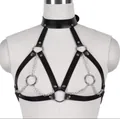 Detailed view of punk style black leather chest harness with silver metal chains and rings - Yellow