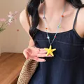 Collana stile spiaggia estiva con ciondolo a stella marina gialla e perline colorate - Collana stella marina gialla