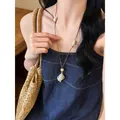 Collana lunga con conchiglia stile New Chinese maglione gioielli boho da donna - Collana conchiglia caffè