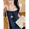 Collana lunga a tema oceano con ciondoli a forma di stella marina e conchiglia marrone - Collana stella marina caffè