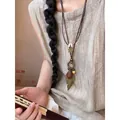 Collana lunga in stile etnico con ciondoli a foglia e stella in metallo da donna - Collana con foglie e stelle color bronzo - circa 95 cm