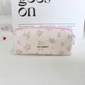 Detail view of a vintage floral print corduroy pencil case with a zipper closure - Purple Pink Small Floral