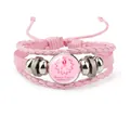 Pink leather braided bracelet with Breast Cancer Awareness Month logo on glass cabochon. - Pink Crown-Awareness Month (12037025)