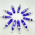 Deep blue hexagonal crystal point pendants with silver bail on white background - Blue (Resin)