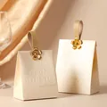 Elegant champagne wedding candy gift bag with golden flower detail and leather strap - Champagne Box + Leather Handle + Flower Plate