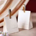Elegant cream wedding candy boxes with gold leather handles and embossed text - Champagne Box + Gold Handle
