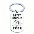 Detailed macro view of a stainless steel keychain engraved with Best Uncle Ever text. - Best Uncle Ever Fist Bump Style (JPB-129)