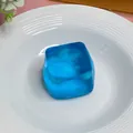 Blue translucent ice cube maltose squeeze toy for stress relief on a white plate. - 5.0 Blue Large Ice Cube (Boxed)