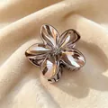 Elegant metallic frangipani flower hair claw clip with a glossy rose gold finish for women. - 8cm Plated Ink Black