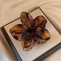 Elegant brown plumeria flower hair claw clip perfect for beach vacation hair styling - 8cm Tortoiseshell