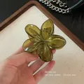 Elegant transparent green plumeria flower hair claw clip in a tropical resort style - 8cm Green