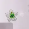 Green transparent plumeria flower hair claw clip for elegant beach vacation styling - 8cm Clear with Green Core