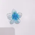 Elegant blue plumeria flower hair claw clip with translucent gradient petals - 8cm Clear with Blue Core
